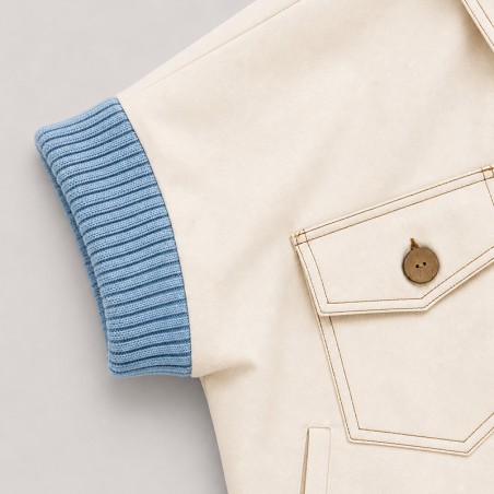 Blouson blanc cassé avec bord côte ciel sans manches