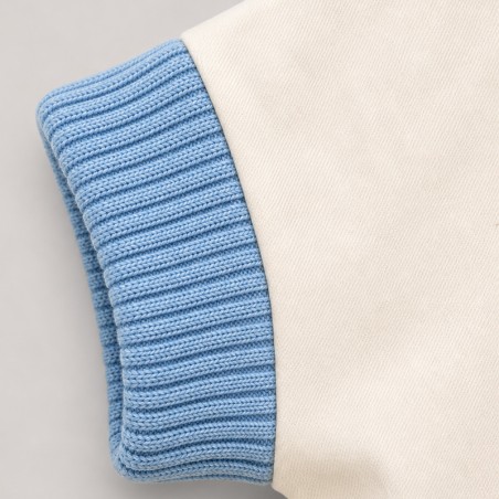 Blouson blanc cassé avec bord côte ciel sans manches